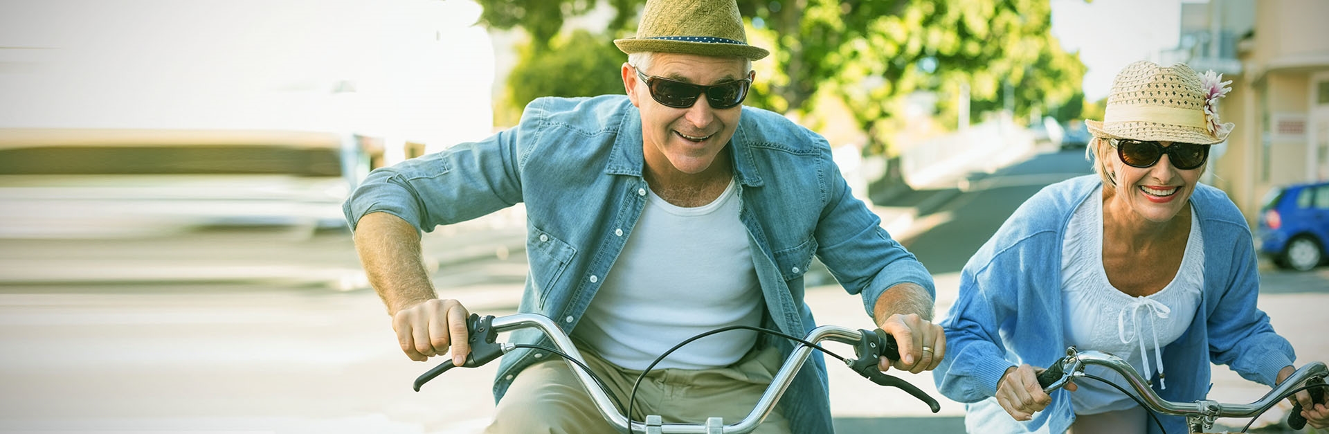 retired couple riding a bike